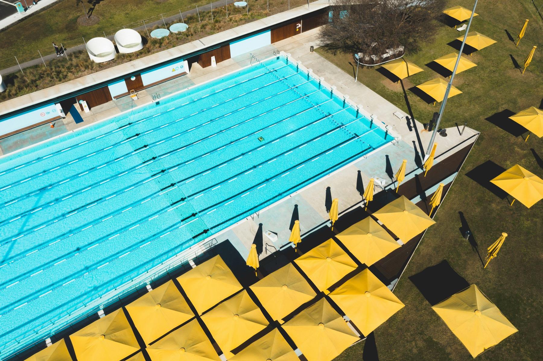 Swimmer in lane pool training with structure
